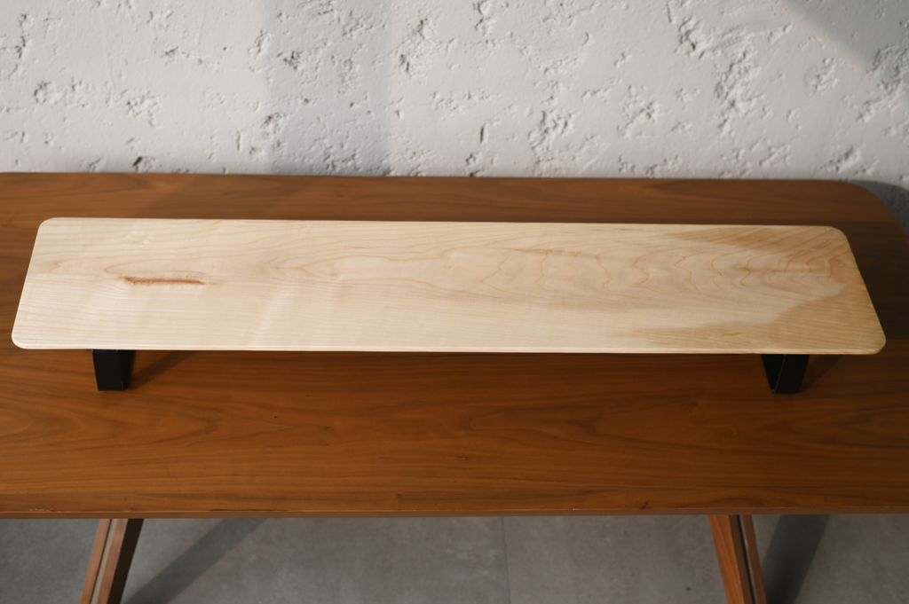 Wooden desk shelf with a plain background