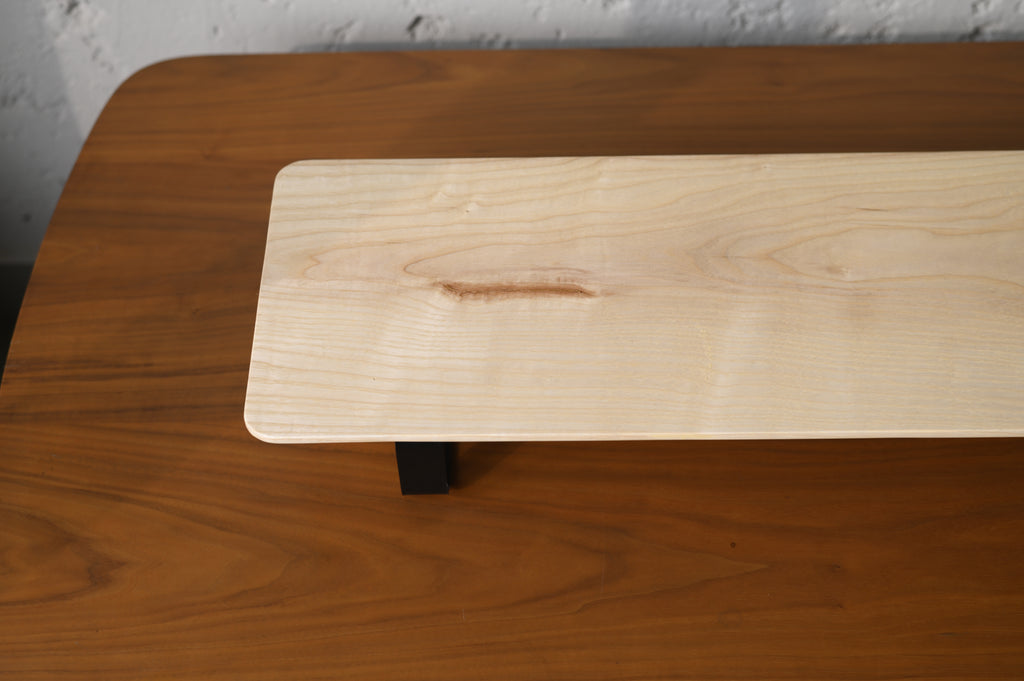 Wooden surface with a natural oil desk shelf on top